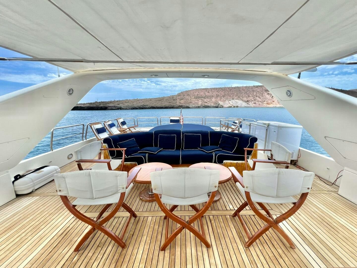 a boat with chairs and tables aboard GARI Yacht for Sale