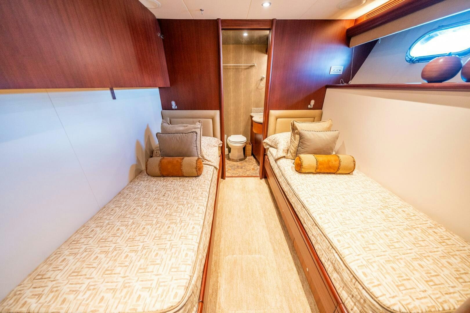 a room with a bed and a couch aboard E Yacht for Sale