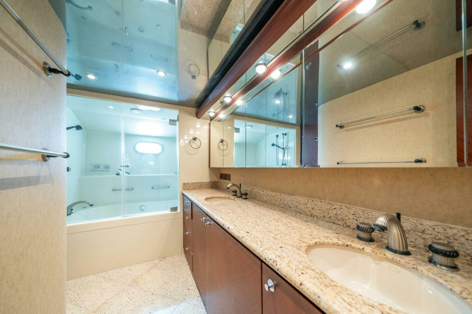 a bathroom with a large mirror aboard E Yacht for Sale