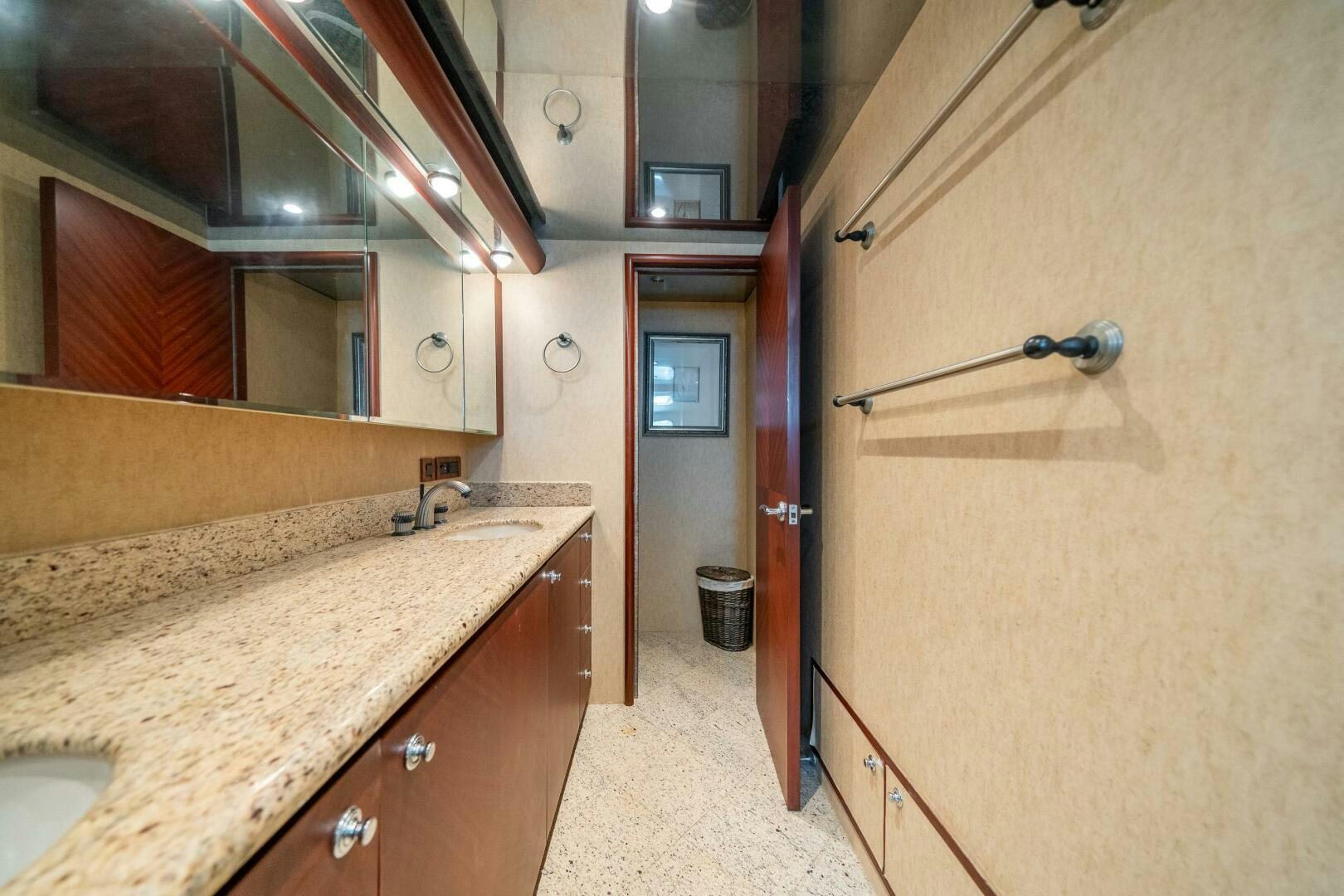 a bathroom with a countertop sink and mirror aboard E Yacht for Sale