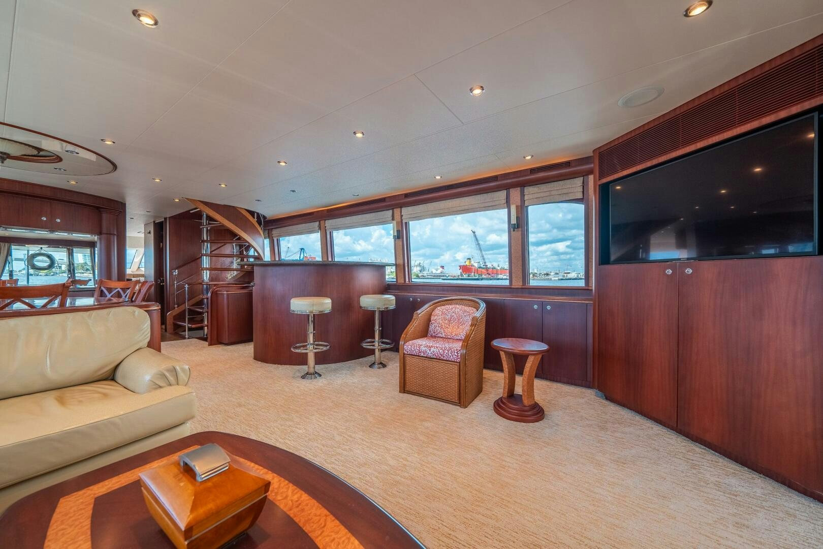 a living room with a wood floor aboard E Yacht for Sale