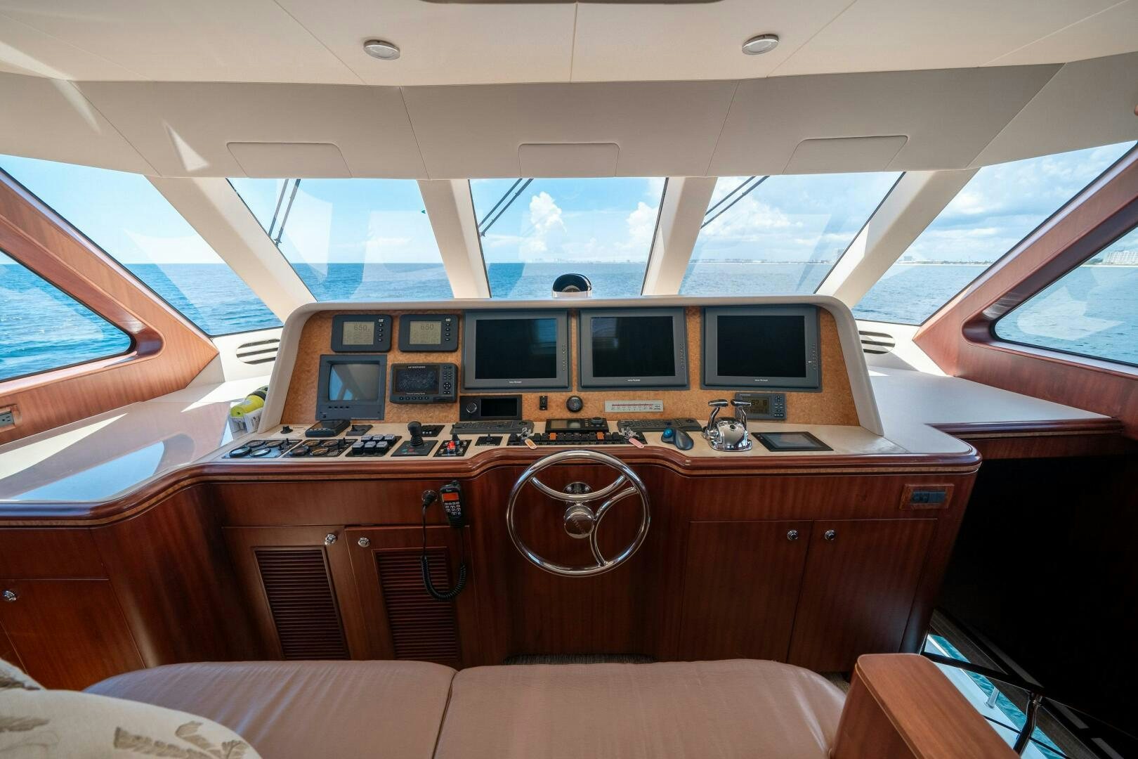 a vehicle with a computer on the counter aboard E Yacht for Sale
