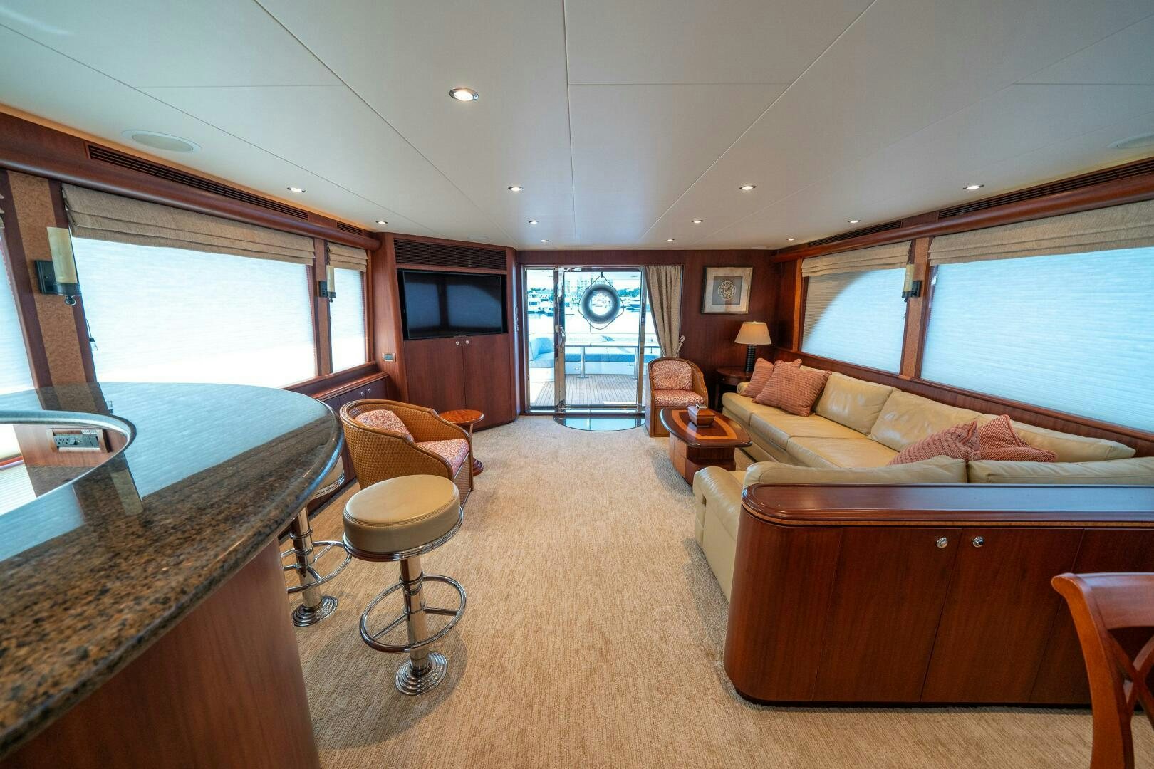 a living room with a large window aboard E Yacht for Sale