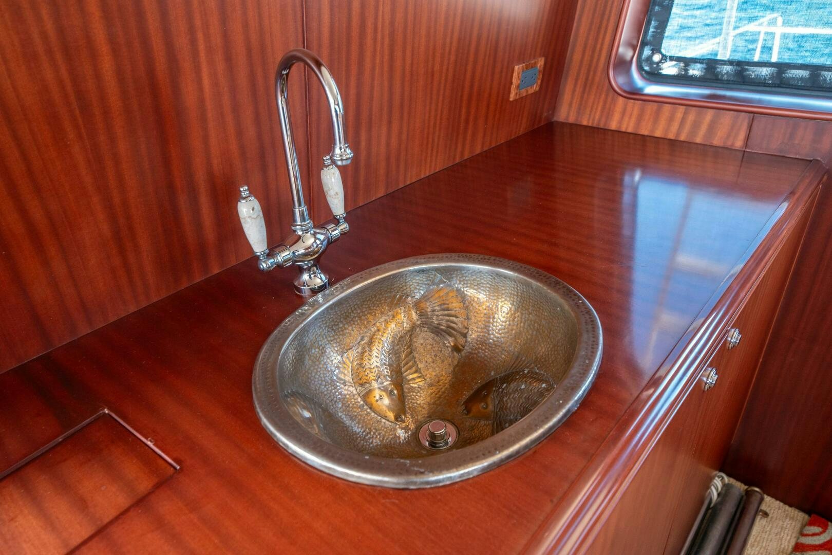 a sink with a faucet aboard E Yacht for Sale