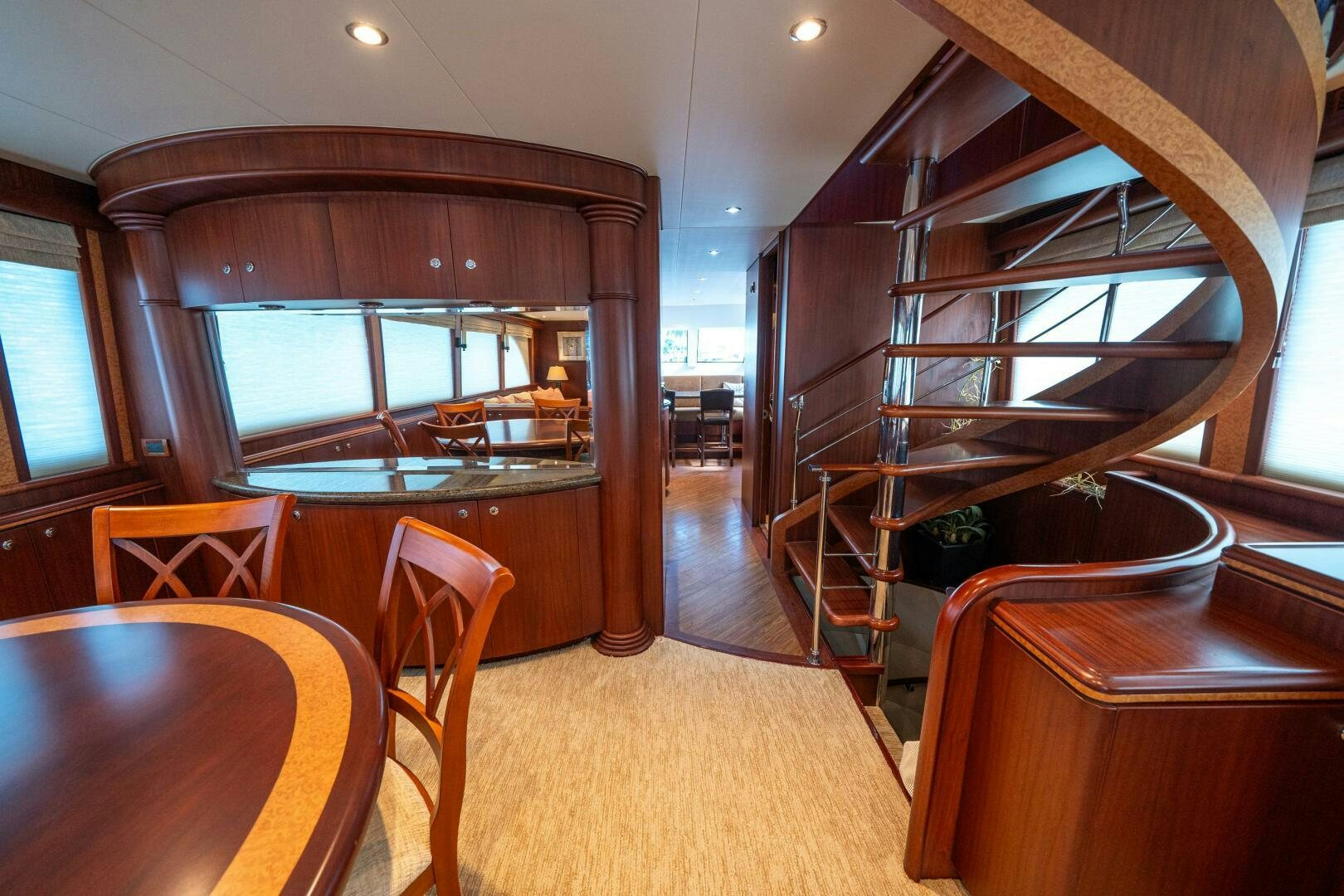 a room with a table and chairs aboard E Yacht for Sale