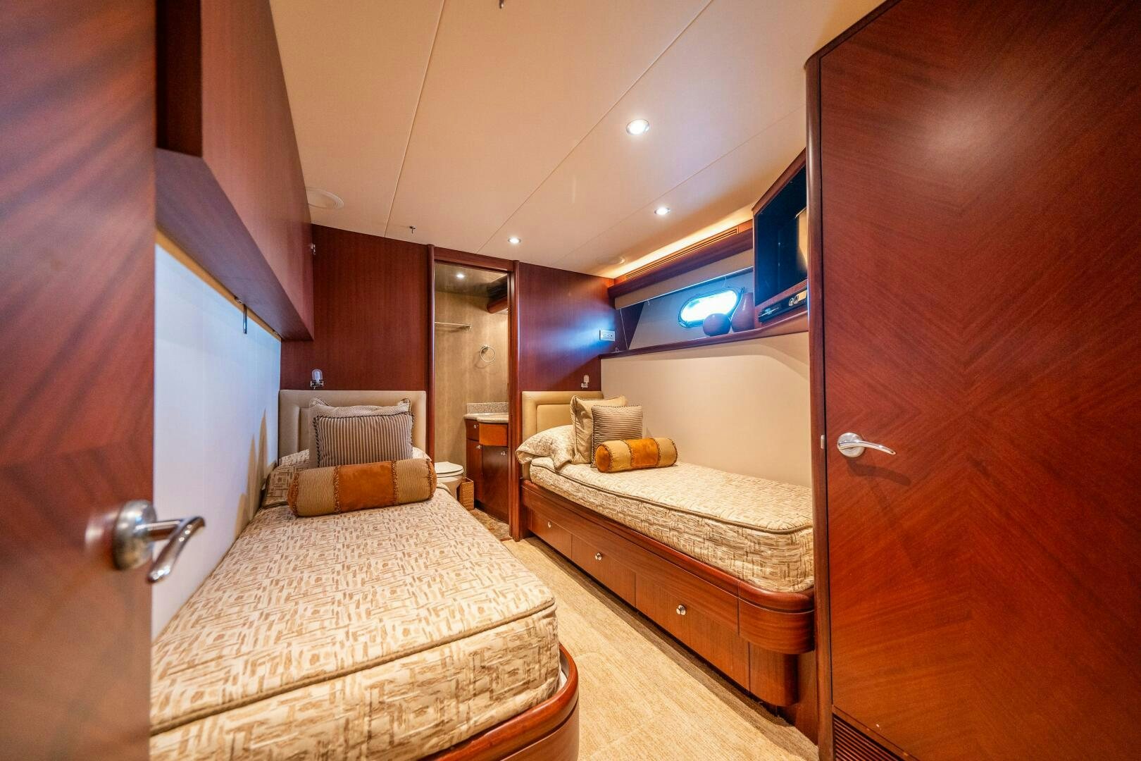 a room with two beds aboard E Yacht for Sale