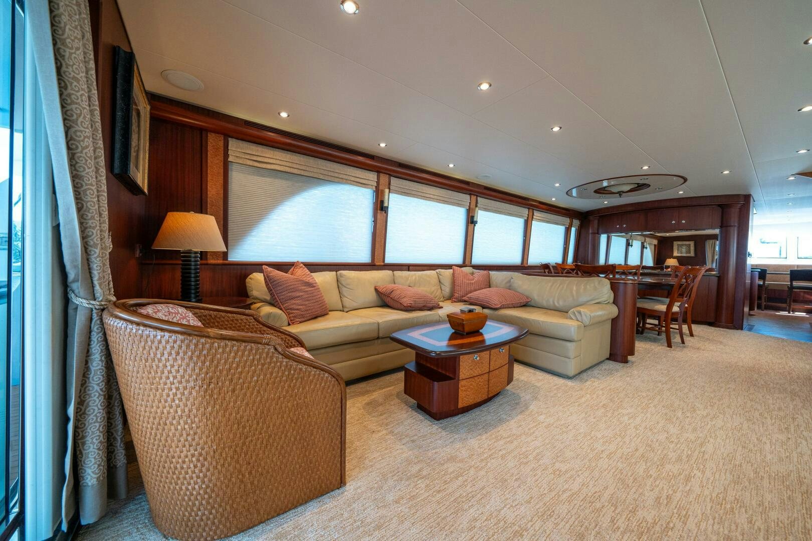 a living room with a couch and a table aboard E Yacht for Sale