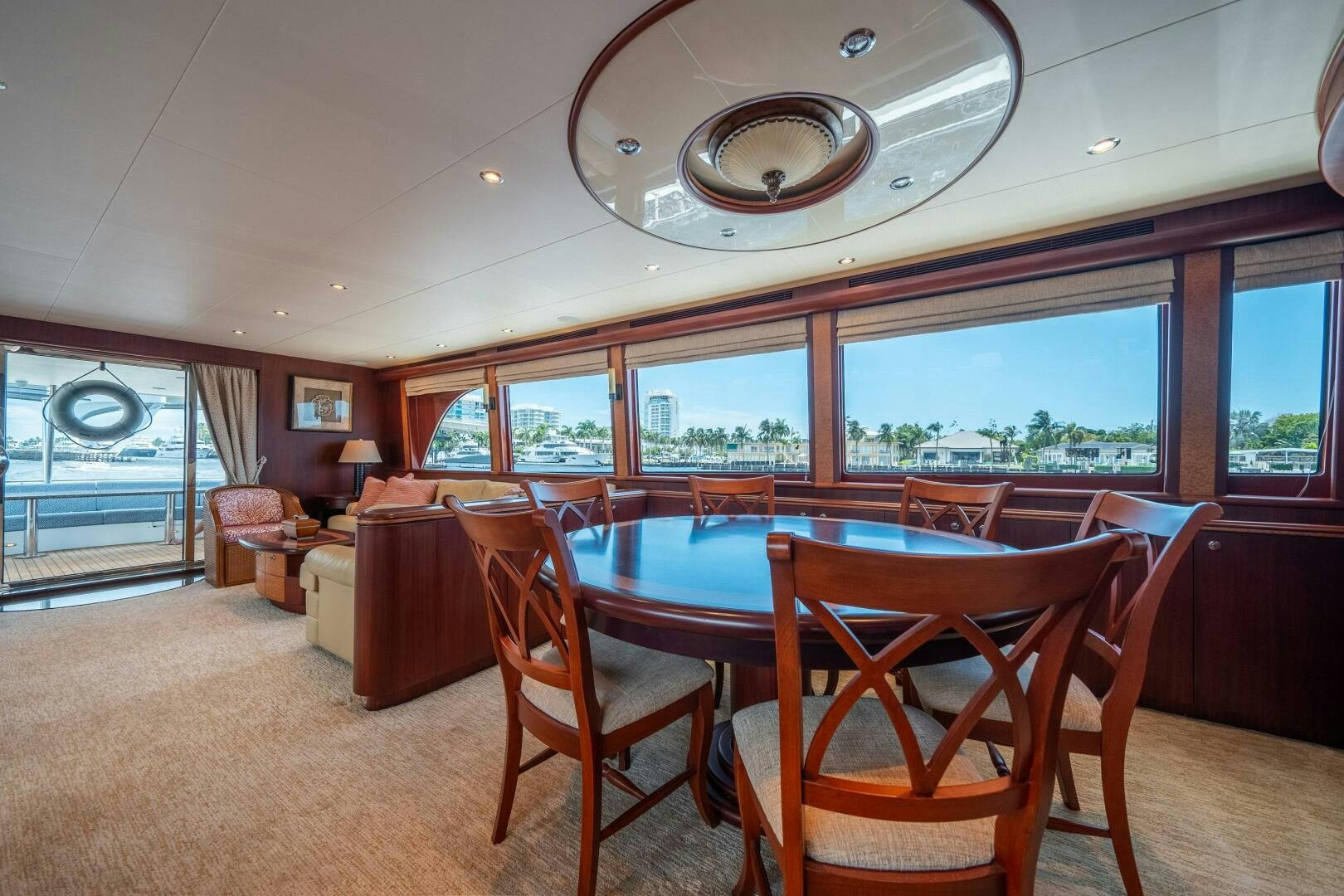 a large dining room with a large table and chairs aboard E Yacht for Sale