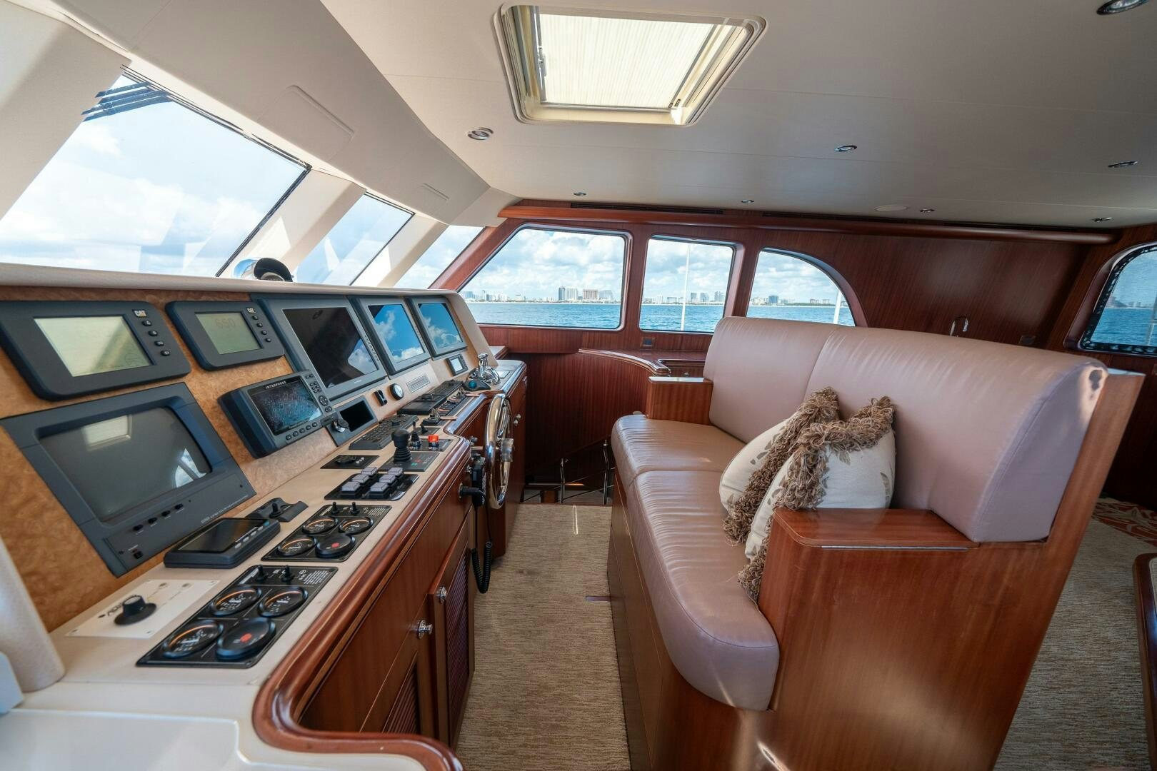 a living room with a couch and a tv aboard E Yacht for Sale