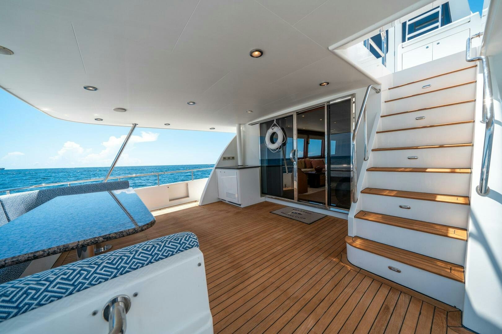 a room with a bed and a large window aboard E Yacht for Sale