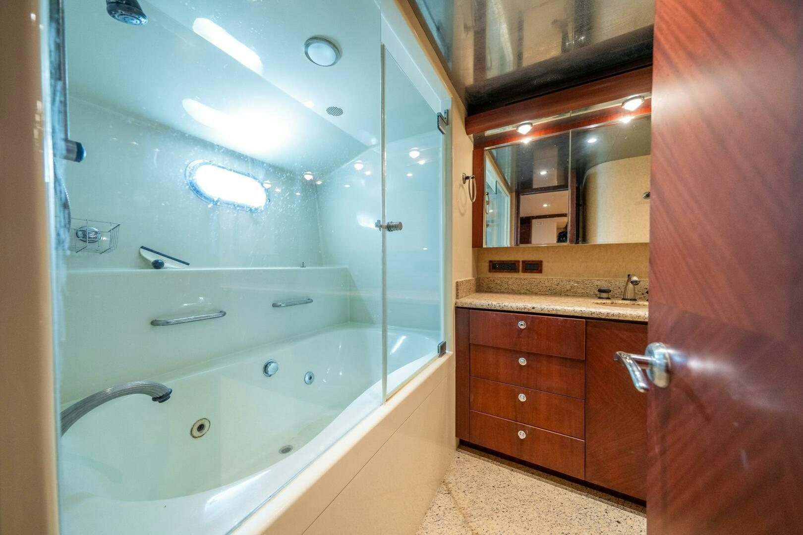 a bathroom with a large mirror aboard E Yacht for Sale