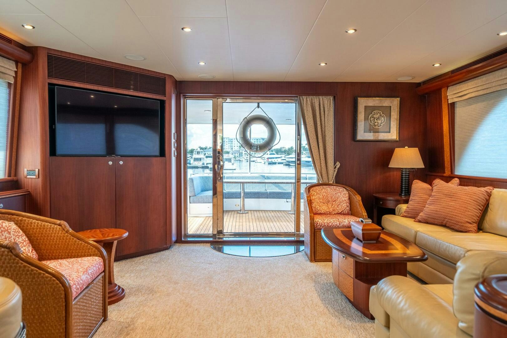 a living room with a sliding glass door aboard E Yacht for Sale
