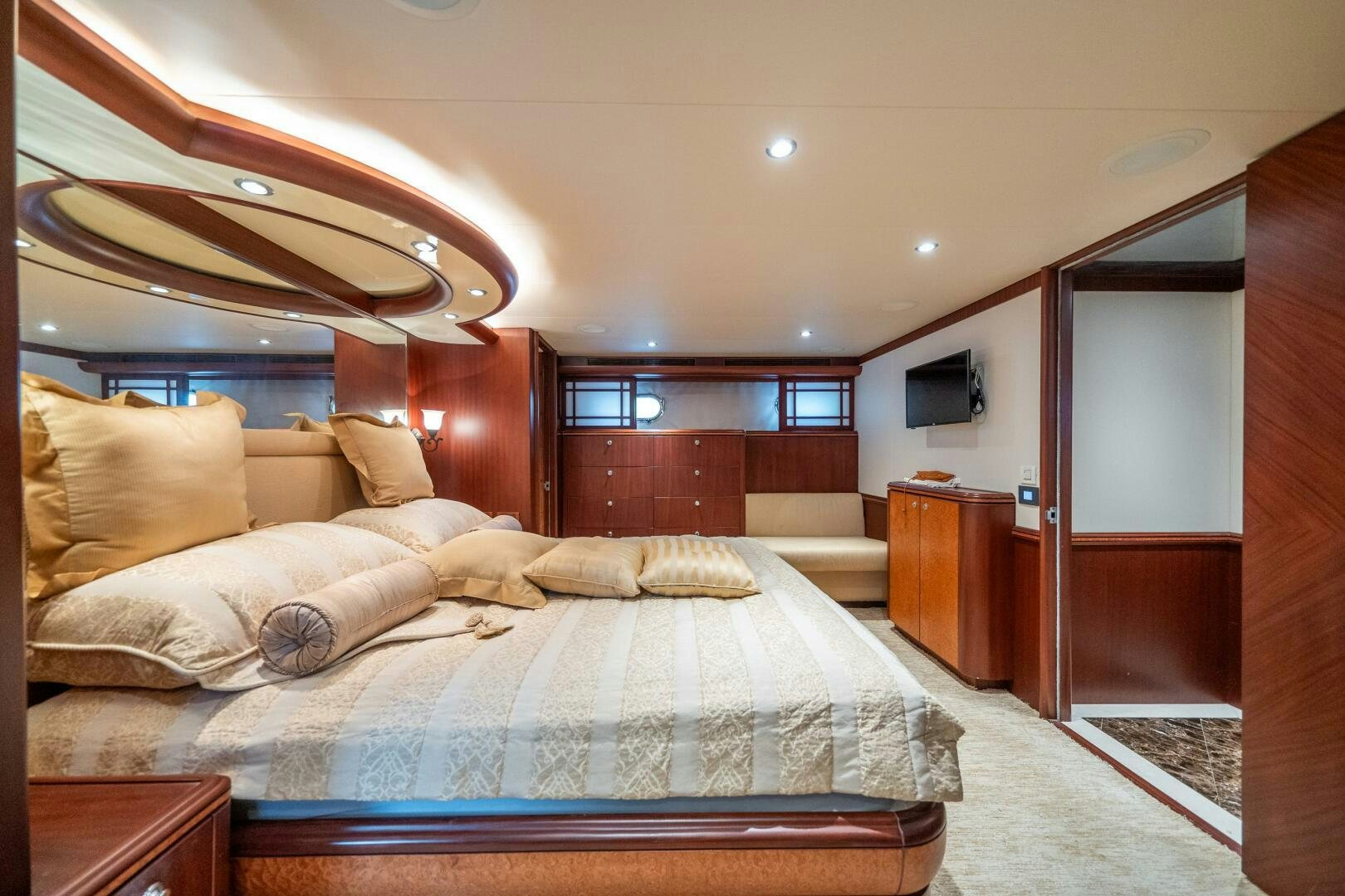 a bedroom with a bed and a television aboard E Yacht for Sale