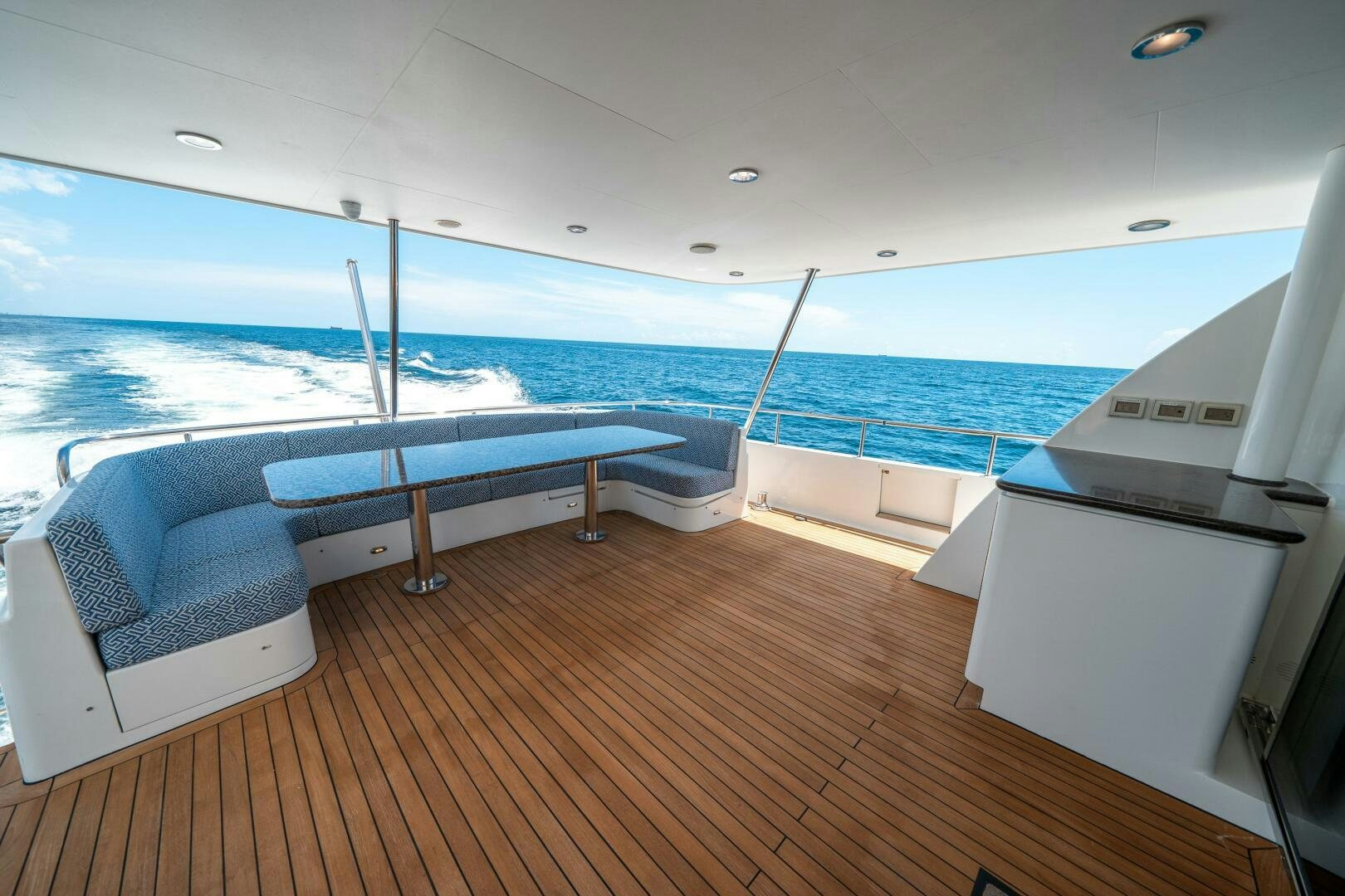 a deck with a view of the ocean and the deck aboard E Yacht for Sale