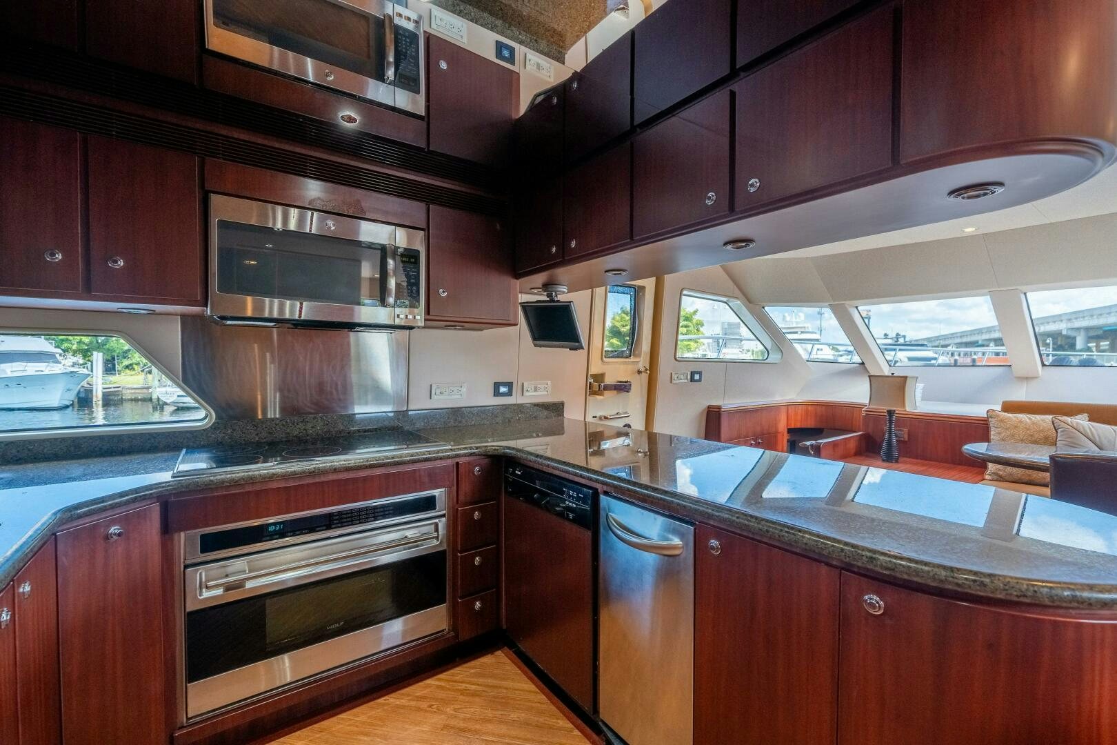 a kitchen with wooden cabinets aboard E Yacht for Sale