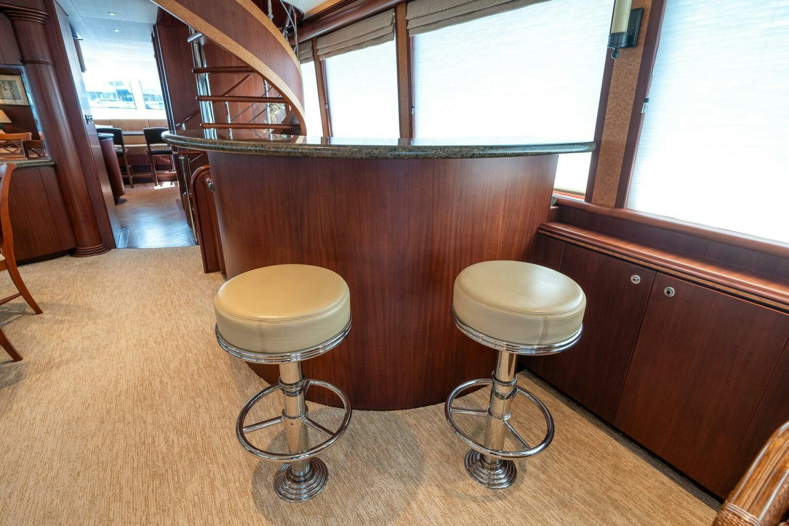 stools in a room aboard E Yacht for Sale