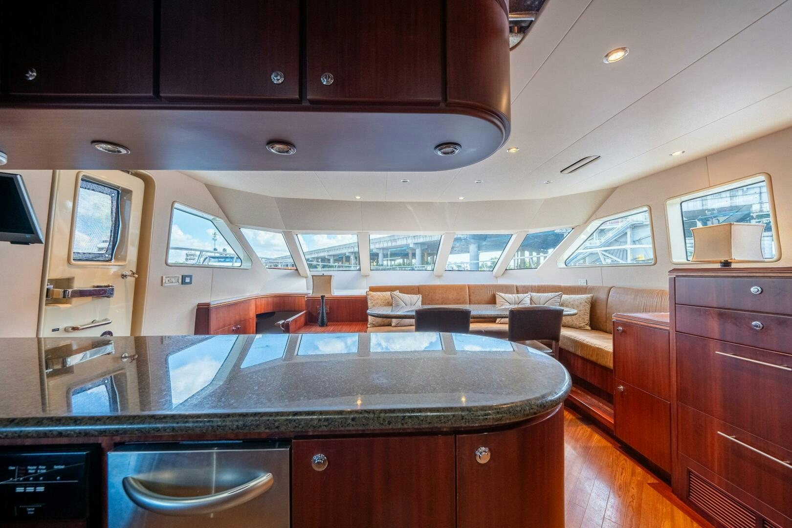 a kitchen with a bar and a bar aboard E Yacht for Sale