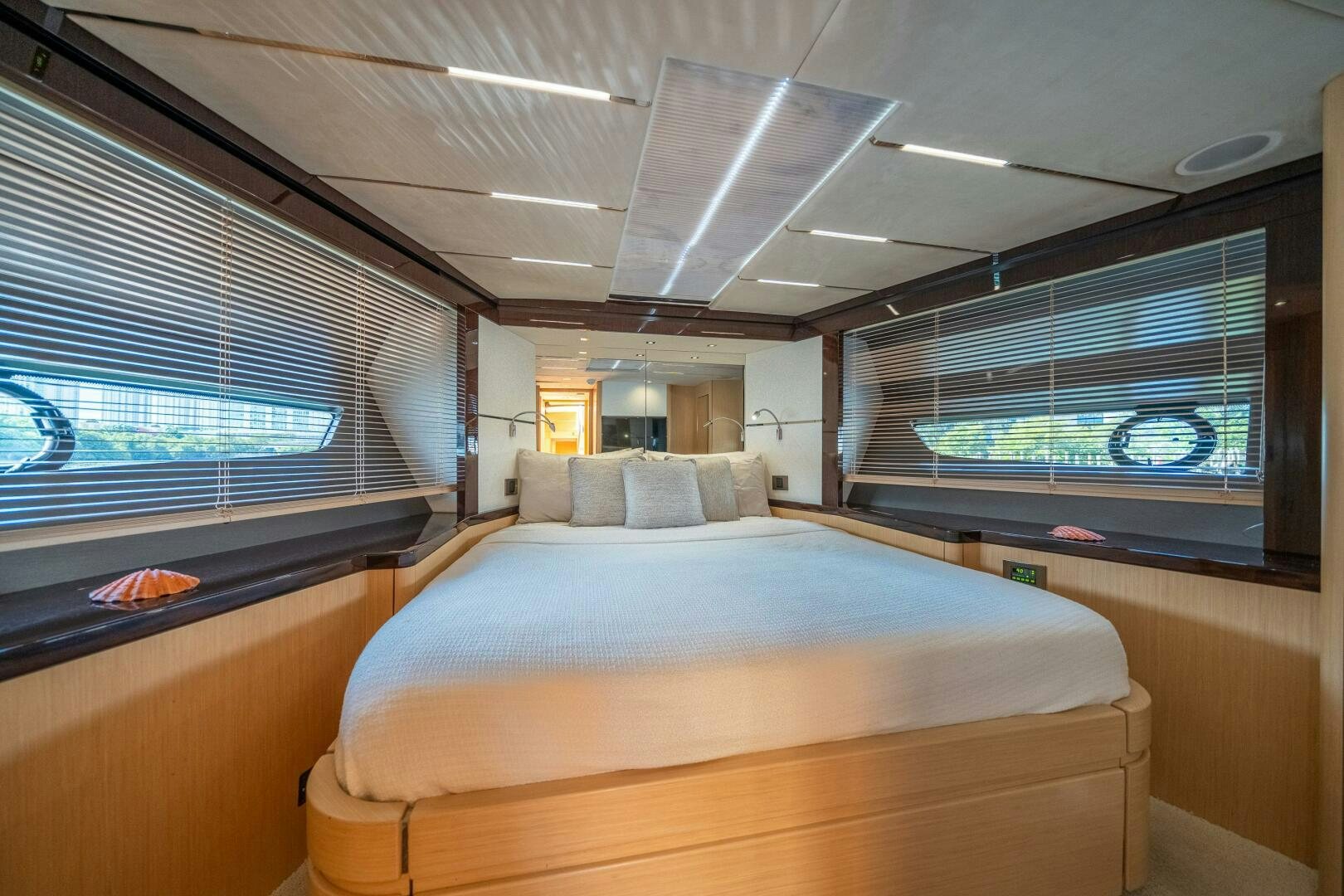 a room with a bed and a window aboard MYLE Yacht for Sale