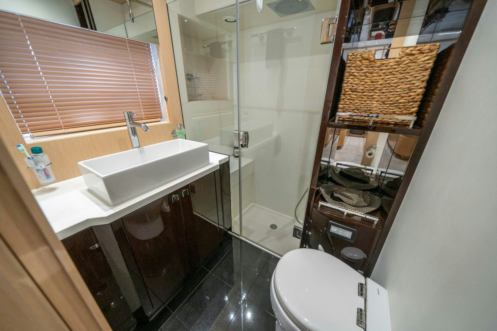 a bathroom with a sink and a toilet aboard MYLE Yacht for Sale