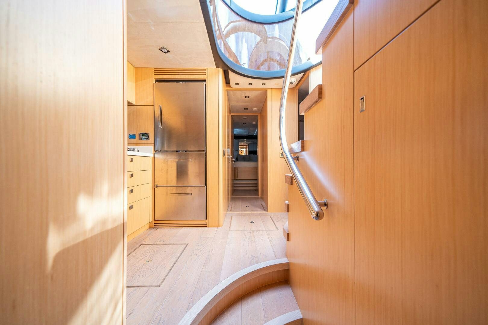 a hallway with wood cabinets aboard MYLE Yacht for Sale