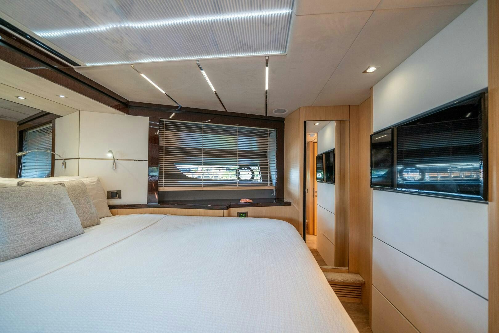 a bed in a room aboard MYLE Yacht for Sale