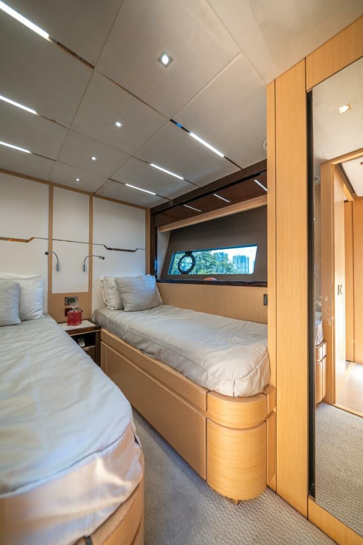 a room with two beds aboard MYLE Yacht for Sale