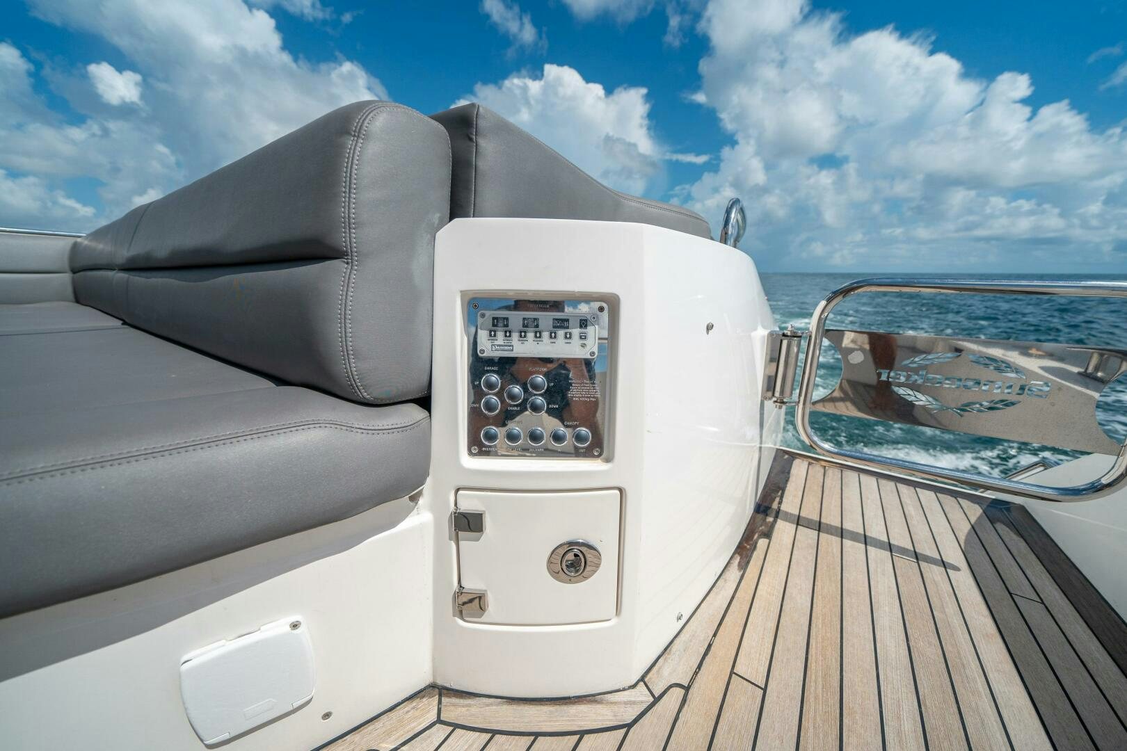 a white car on a dock aboard MYLE Yacht for Sale