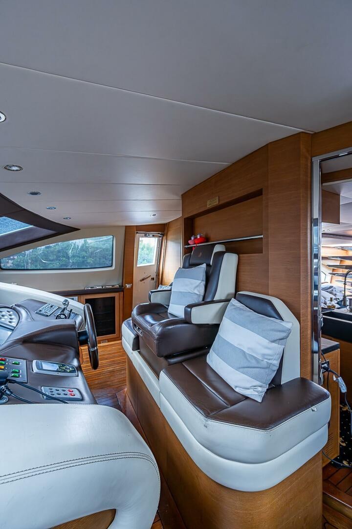 a living room with a couch and a table aboard INTERVENTION Yacht for Sale