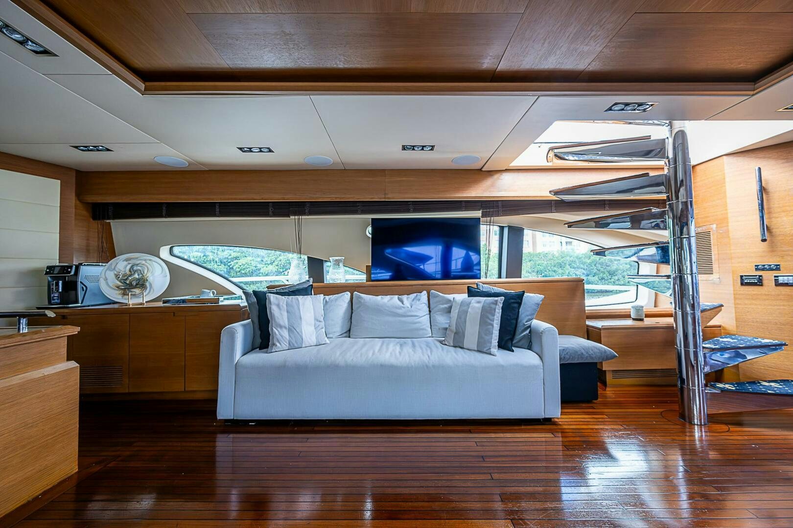 a room with a bed and a wood floor aboard INTERVENTION Yacht for Sale
