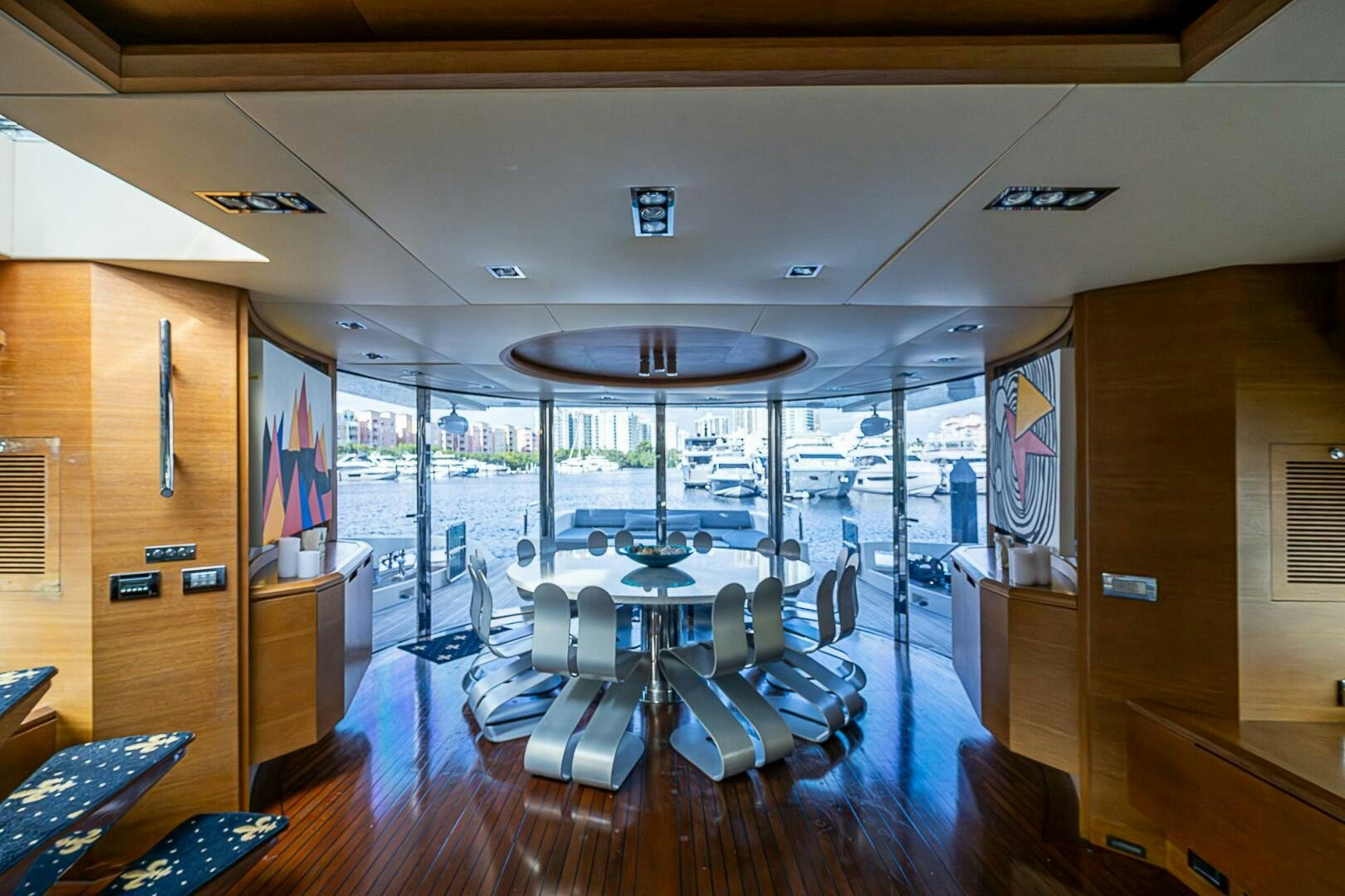a large room with a table and chairs aboard INTERVENTION Yacht for Sale