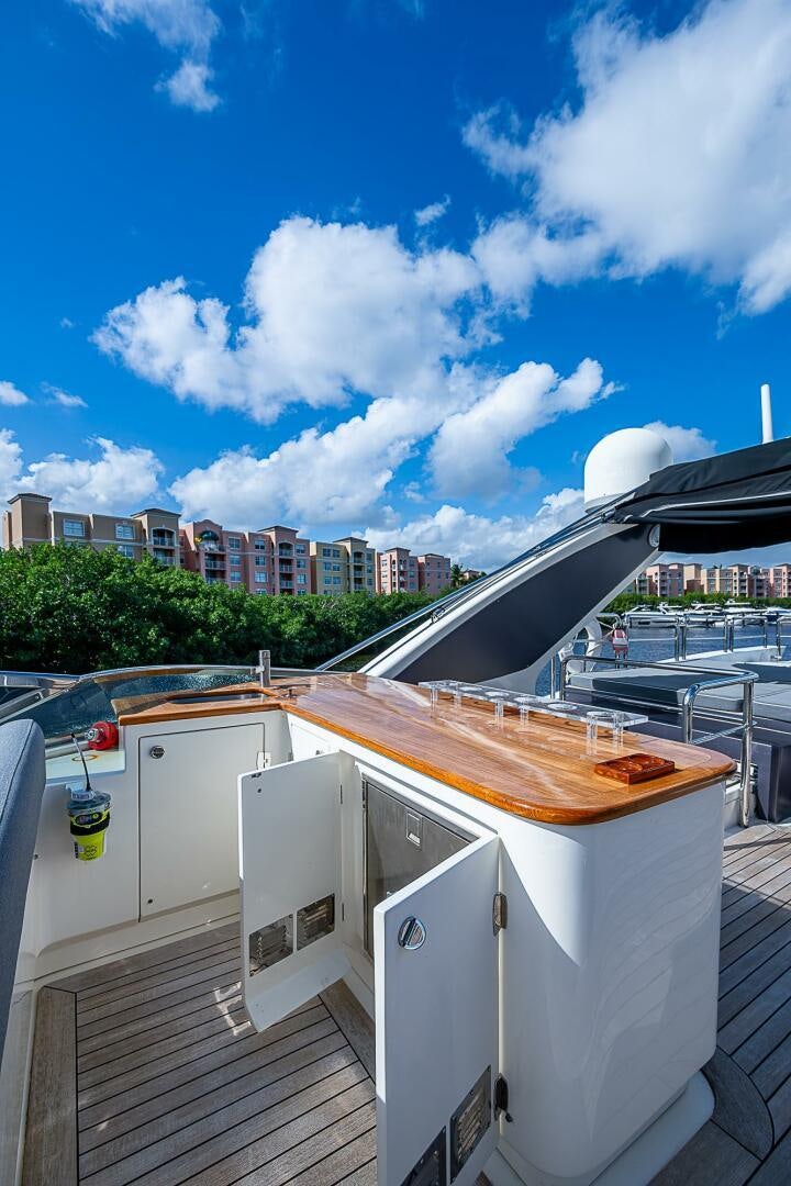 a rooftop with a roof and a building in the background aboard INTERVENTION Yacht for Sale