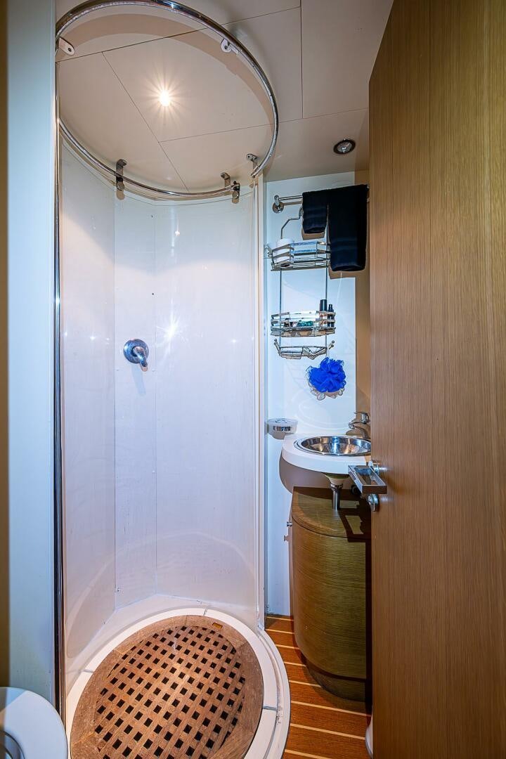 a bathroom with a shower and sink aboard INTERVENTION Yacht for Sale