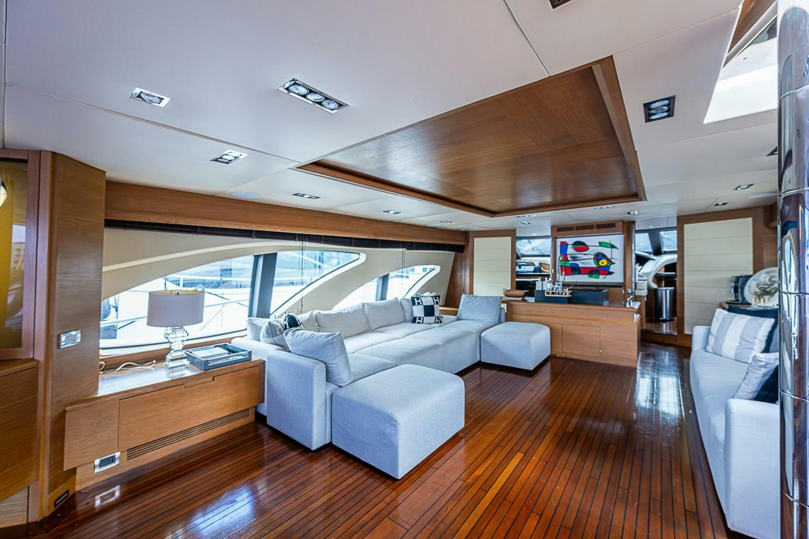 a living room with a large window aboard INTERVENTION Yacht for Sale