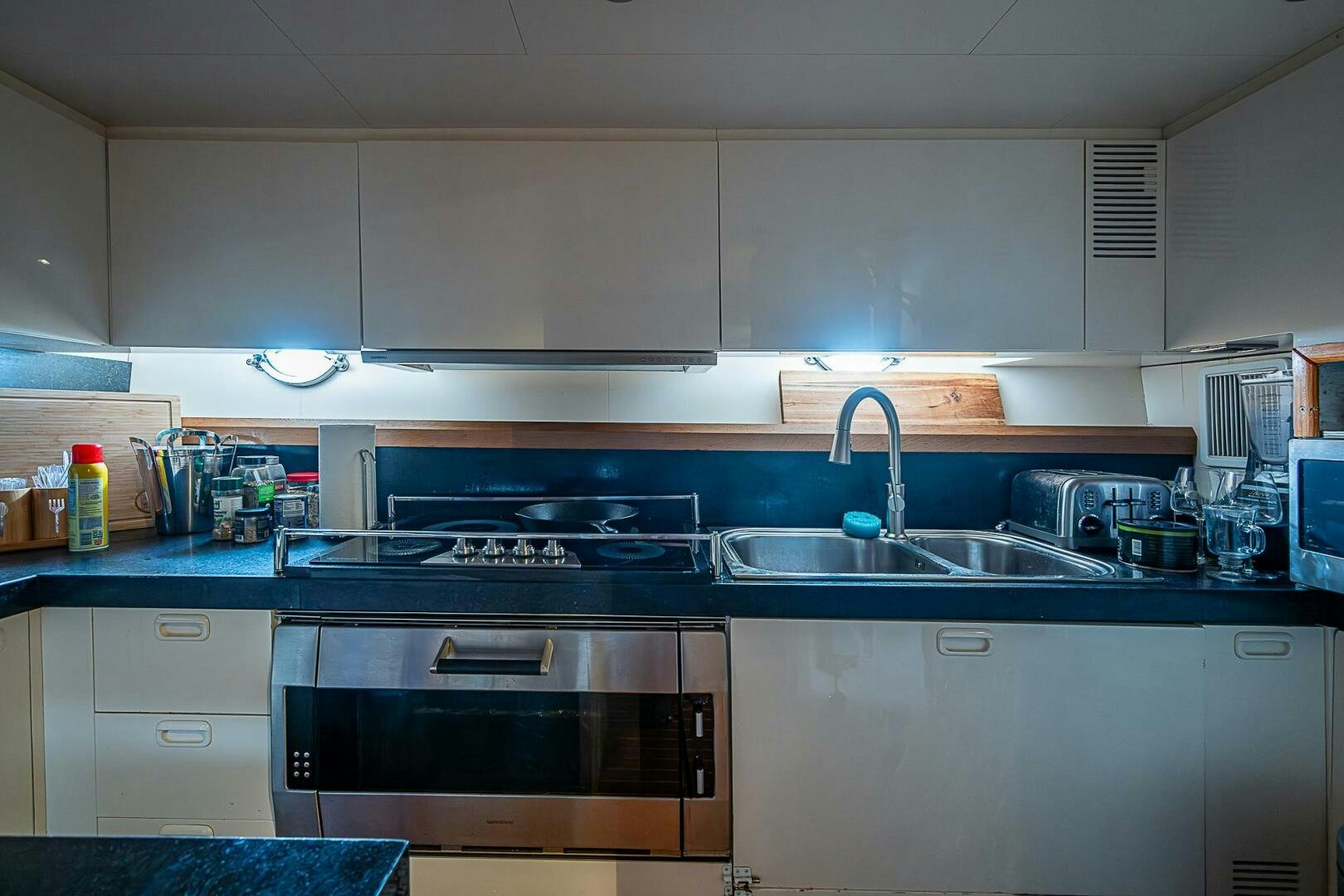 a kitchen with a sink and stove aboard INTERVENTION Yacht for Sale