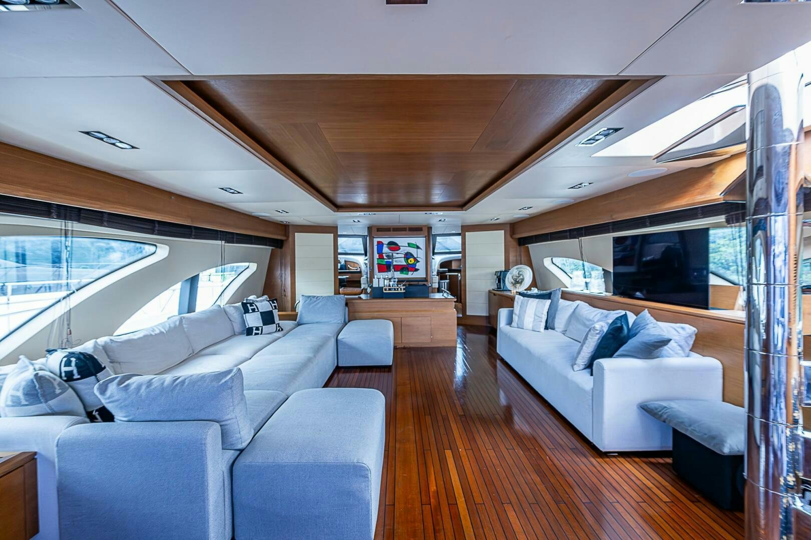 a living room with a large window aboard INTERVENTION Yacht for Sale