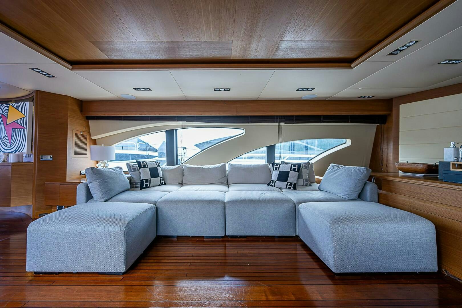a large living room with a large bed aboard INTERVENTION Yacht for Sale
