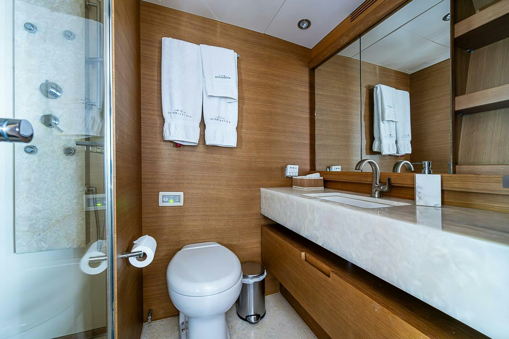 a bathroom with a sink toilet and a bathtub aboard INTERVENTION Yacht for Sale
