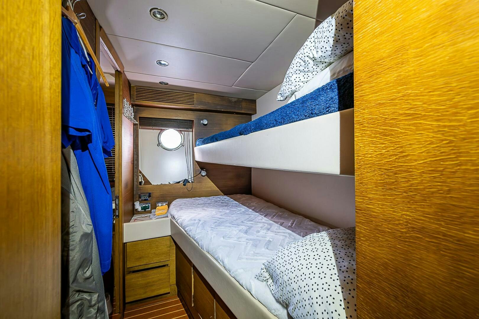 a small bedroom with a bed aboard INTERVENTION Yacht for Sale