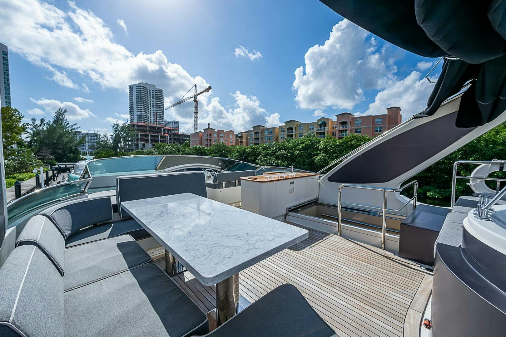 a rooftop with a table and chairs aboard INTERVENTION Yacht for Sale