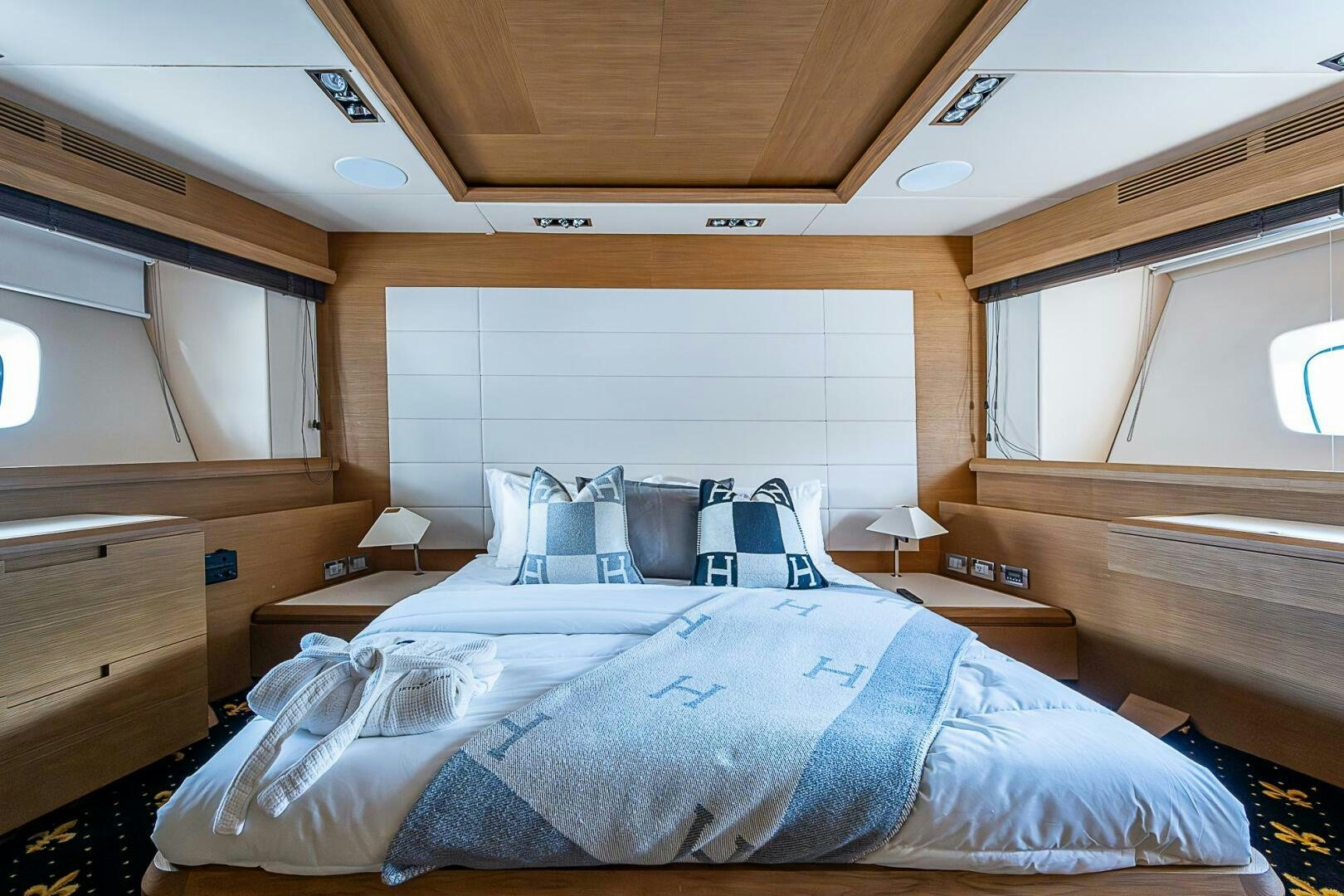 a bed with a blue sheet aboard INTERVENTION Yacht for Sale