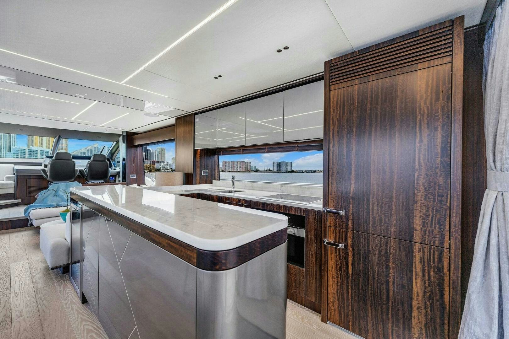 a room with a table and chairs aboard YOU AND ISLANDS Yacht for Sale