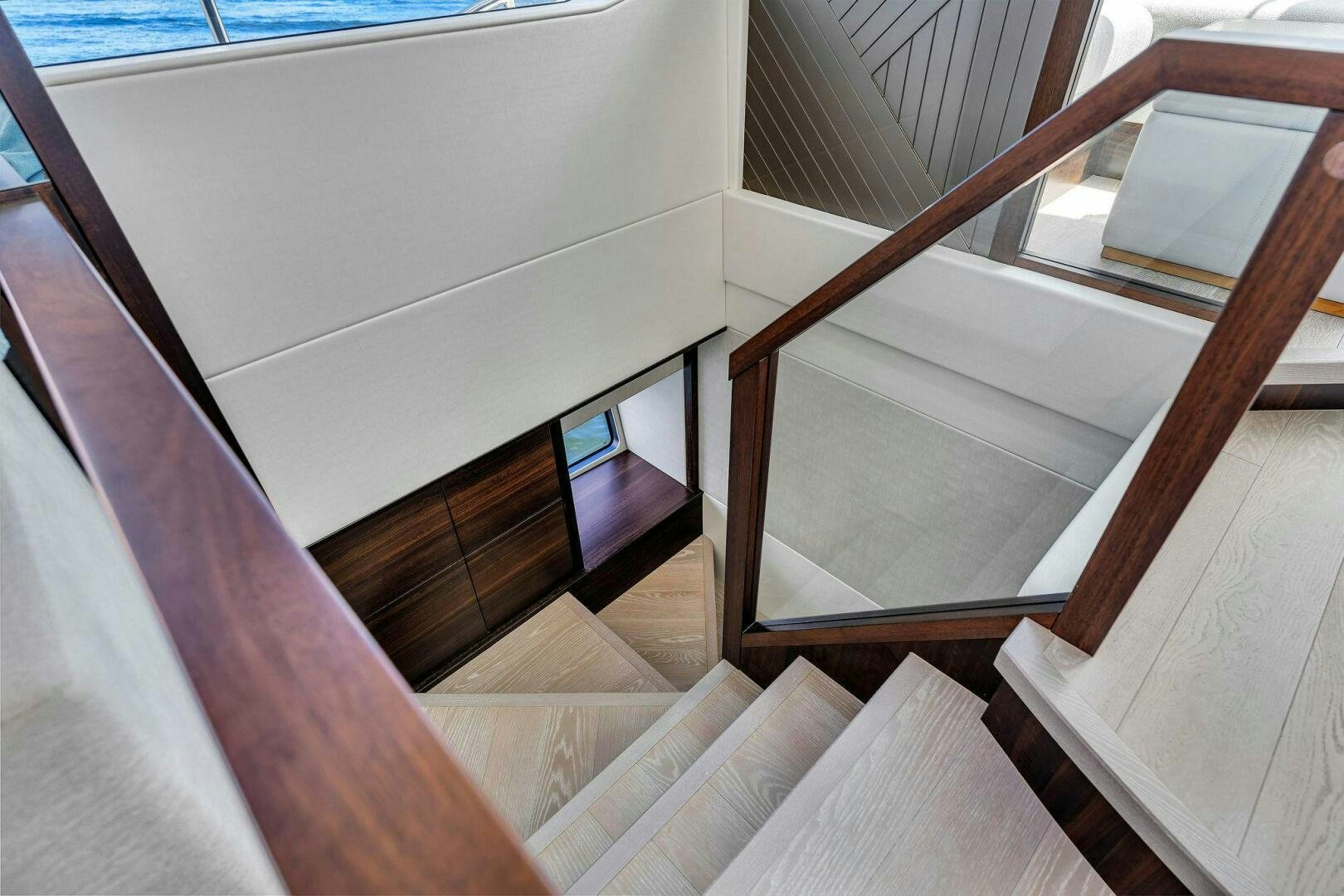 a staircase with a window aboard YOU AND ISLANDS Yacht for Sale