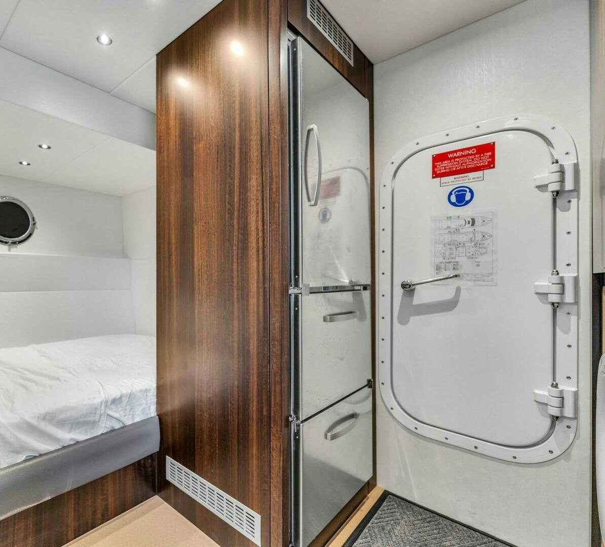 a hospital room with a bed and a closet aboard YOU AND ISLANDS Yacht for Sale