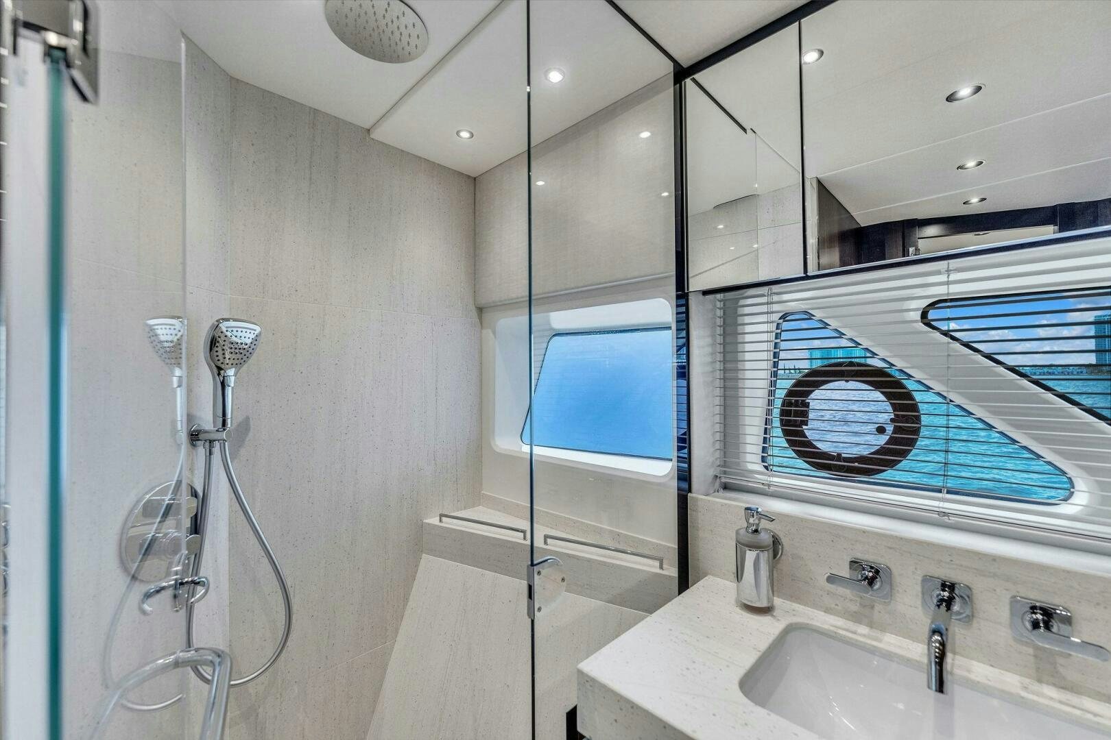 a bathroom with a glass shower aboard YOU AND ISLANDS Yacht for Sale