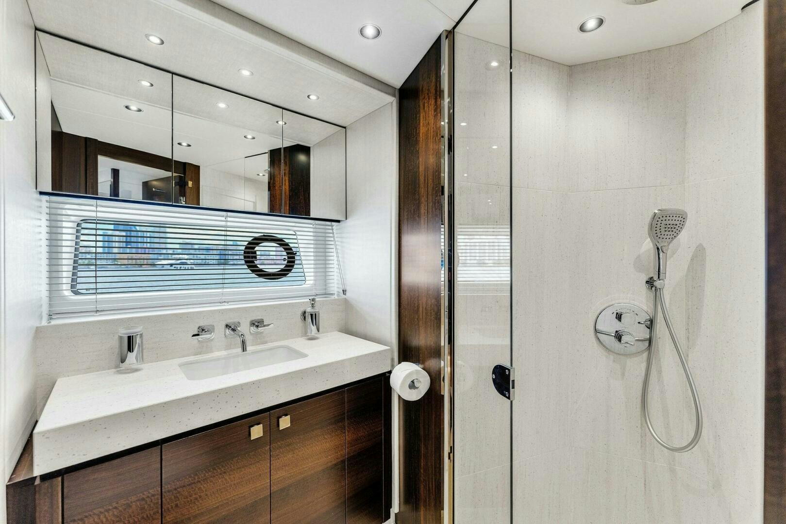 a bathroom with a sink and a mirror aboard YOU AND ISLANDS Yacht for Sale