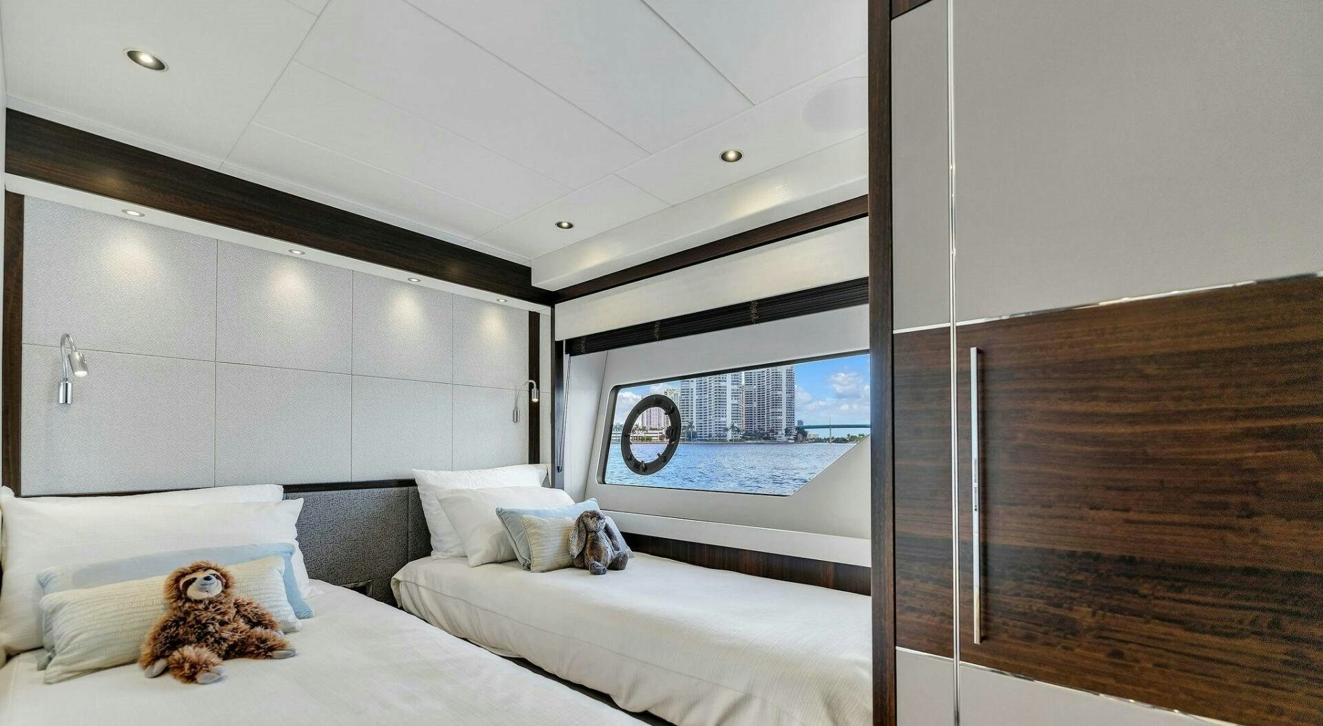 a room with a bed and a window aboard YOU AND ISLANDS Yacht for Sale