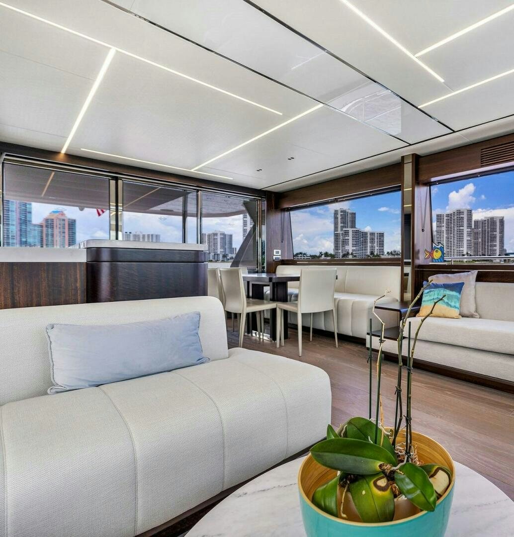 a living room with a couch and a coffee table aboard YOU AND ISLANDS Yacht for Sale
