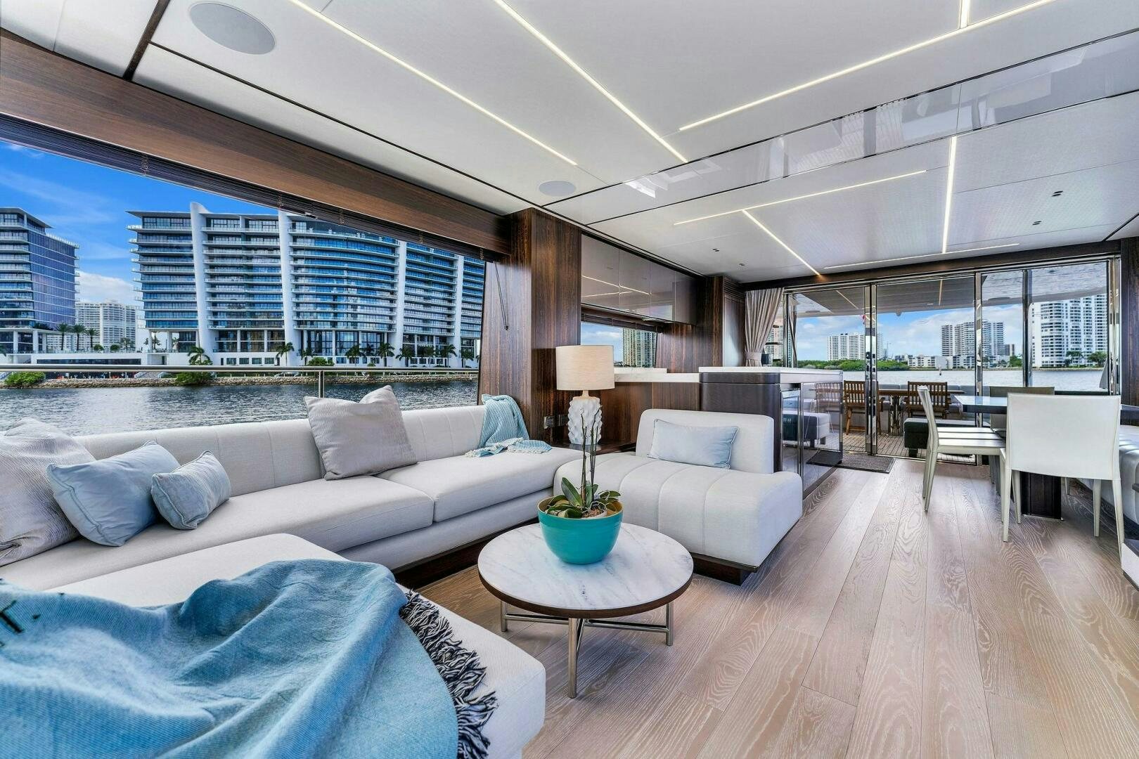 a living room with a large window aboard YOU AND ISLANDS Yacht for Sale
