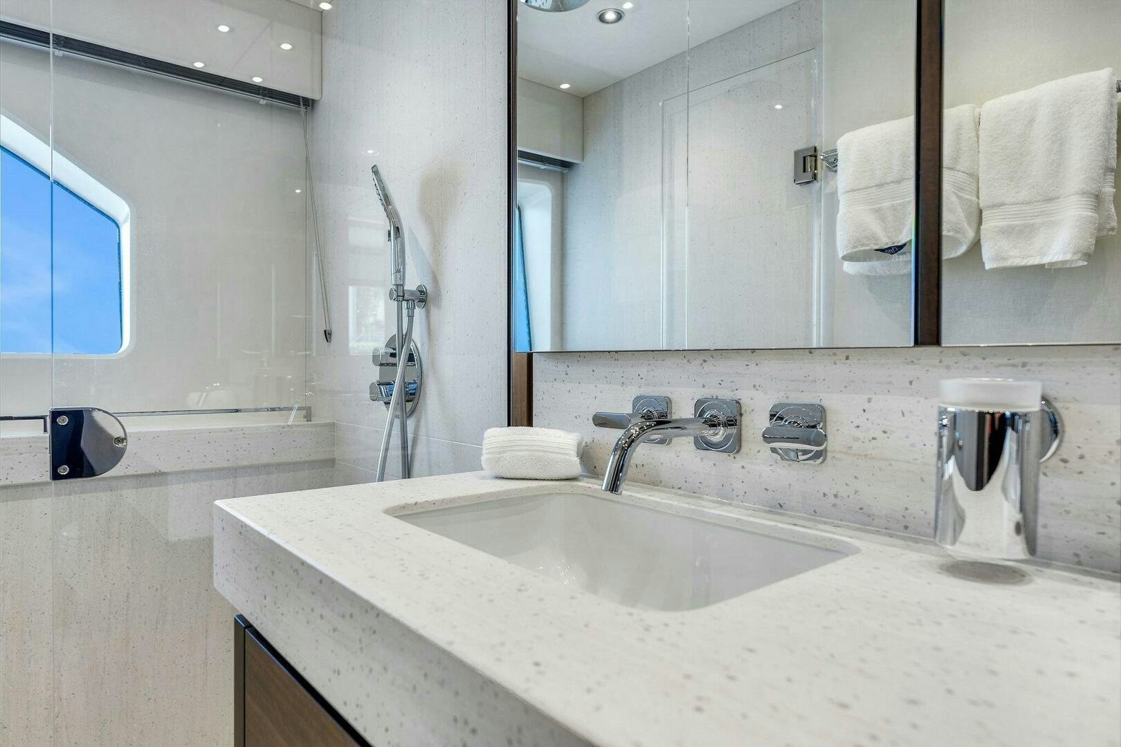 a bathroom with a large mirror aboard YOU AND ISLANDS Yacht for Sale