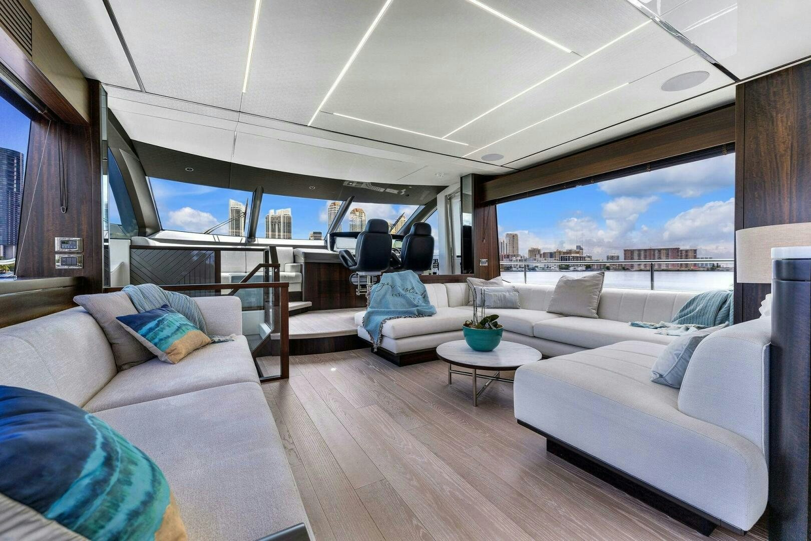 a living room with a large window aboard YOU AND ISLANDS Yacht for Sale